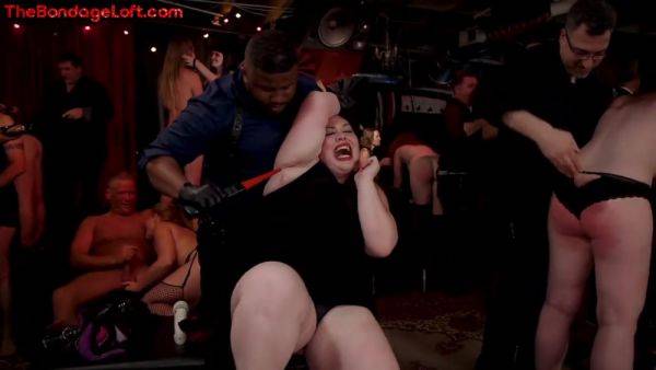 Busty BDSM public redhead whipped in front of voyeurs on royalboobs.com